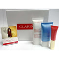 Clarins Skin Care Travel Kit 4 Piece Serum Lotion Cleanser Lip Balm Travel Set