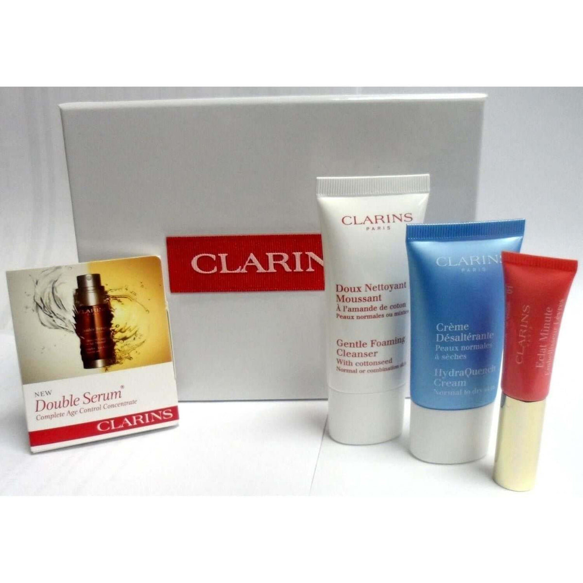 Clarins Skin Care Travel Kit 4 Piece Serum Lotion Cleanser Lip Balm Travel Set